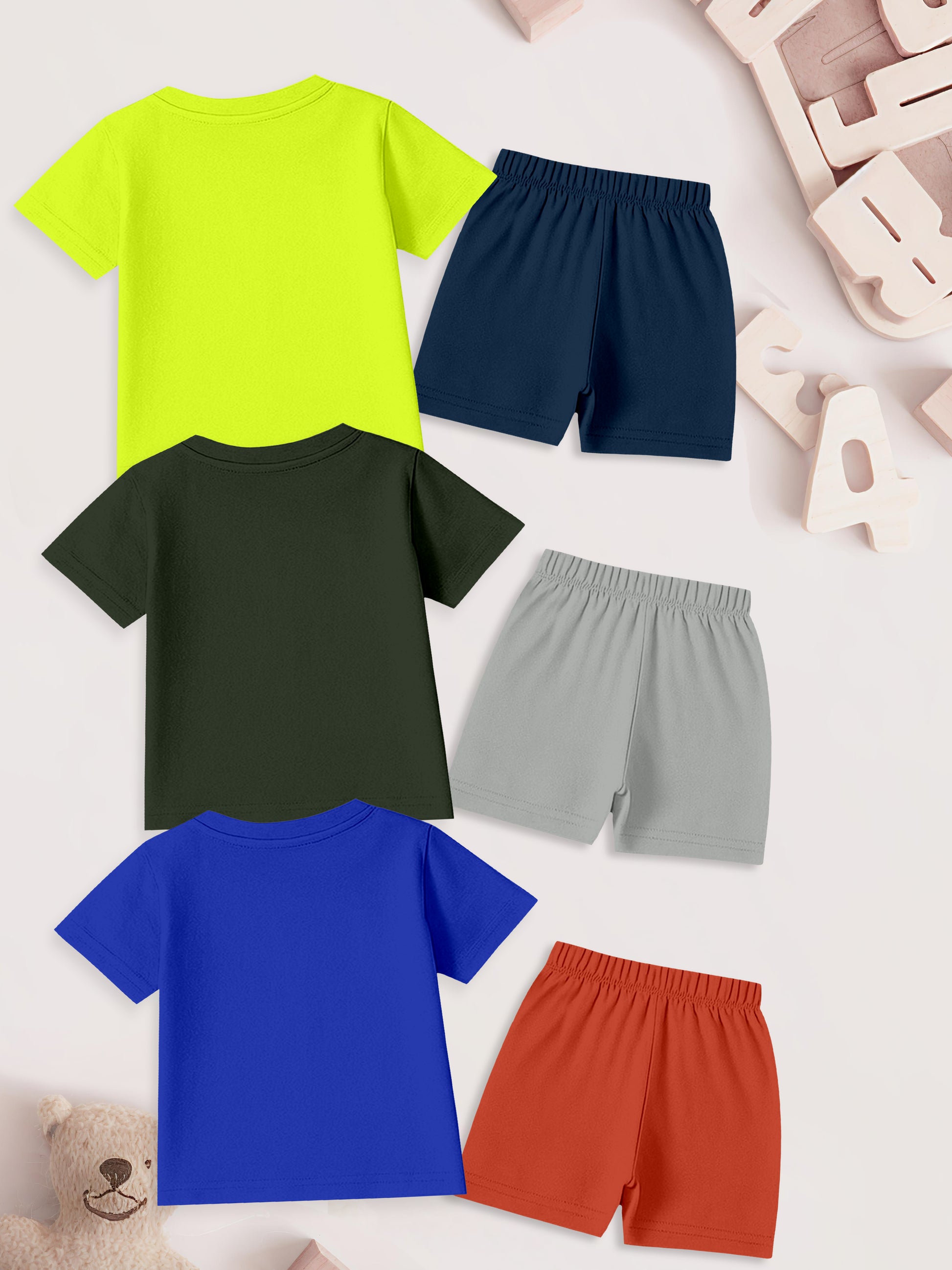Assorted kids short sleeve t-shirts and shorts in yellow, black, blue with matching shorts