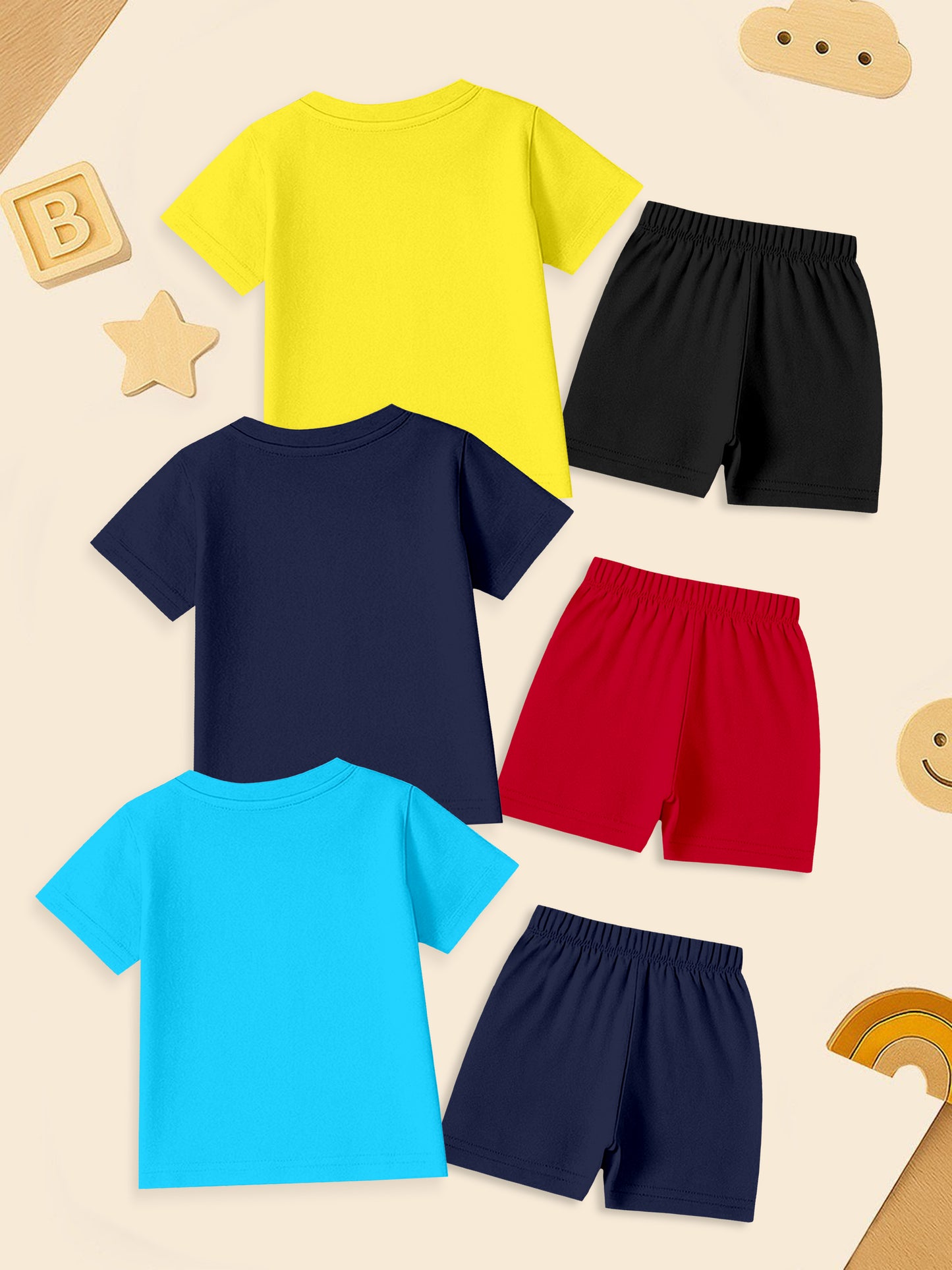 Kids T-shirt and shorts sets in yellow, navy, and blue with playful background toys