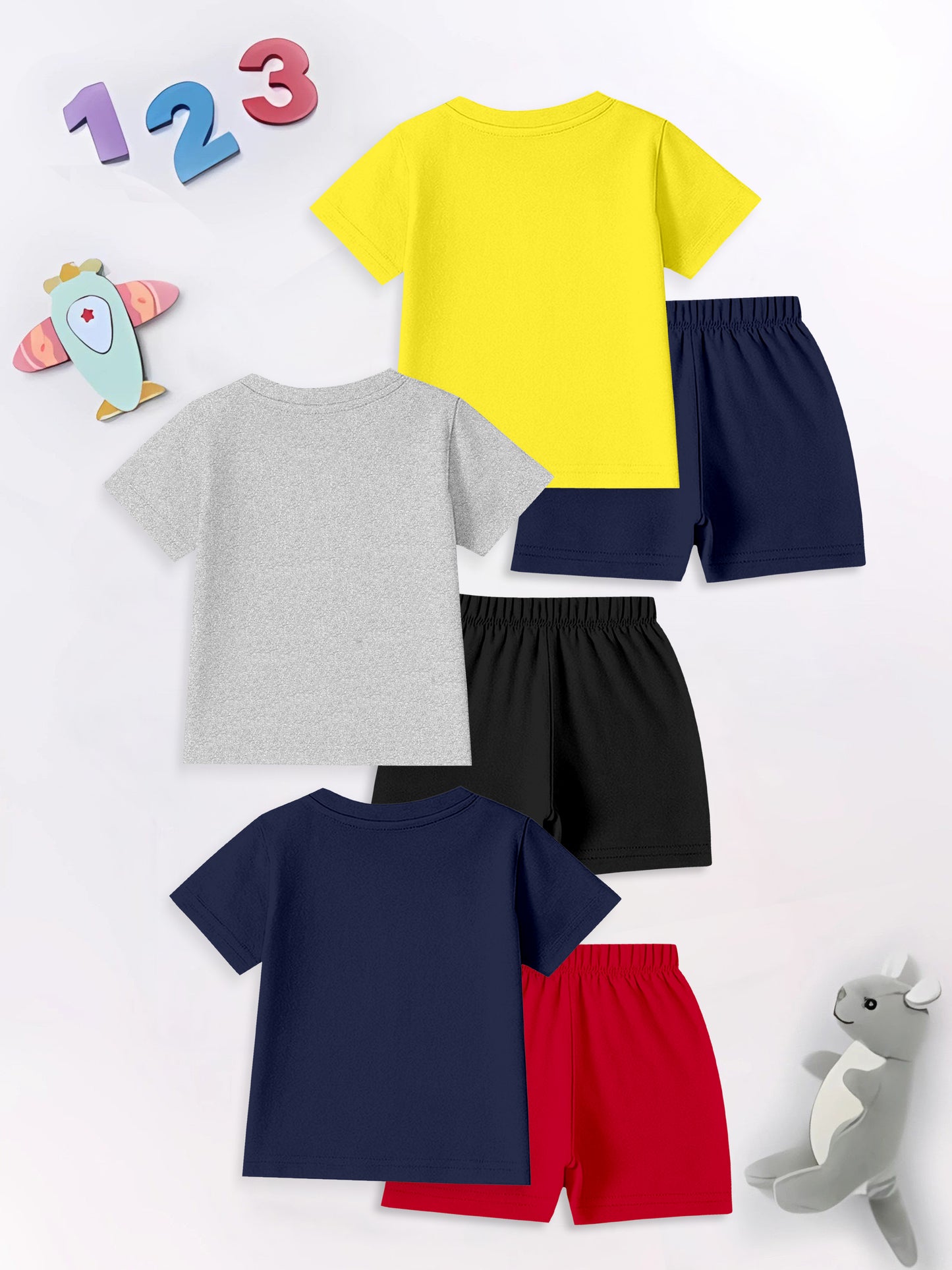Three kids' t-shirt and shorts sets in yellow, gray, and navy, with toys and numbers background