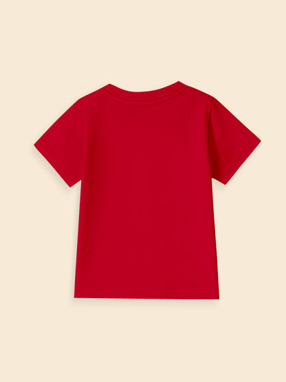 Back view of a plain red short sleeve t-shirt on a beige background