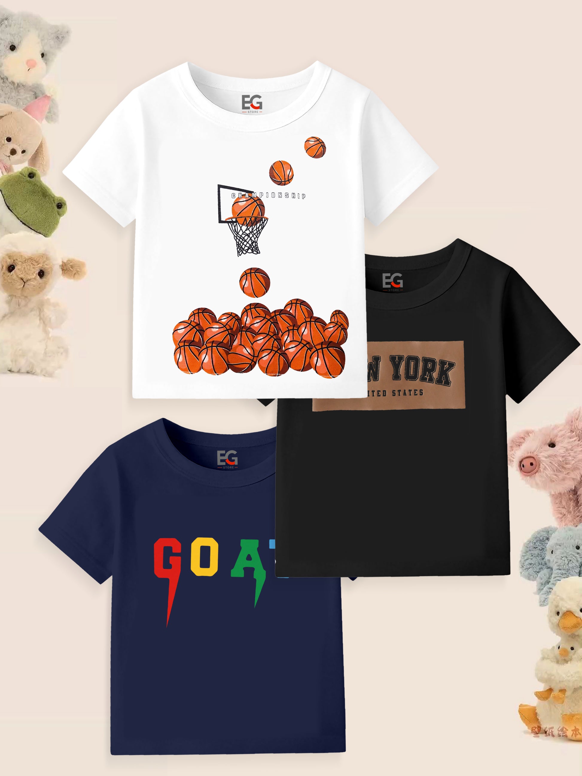 Three kids' graphic t-shirts with basketball, New York, and GOAT designs, surrounded by plush toys.