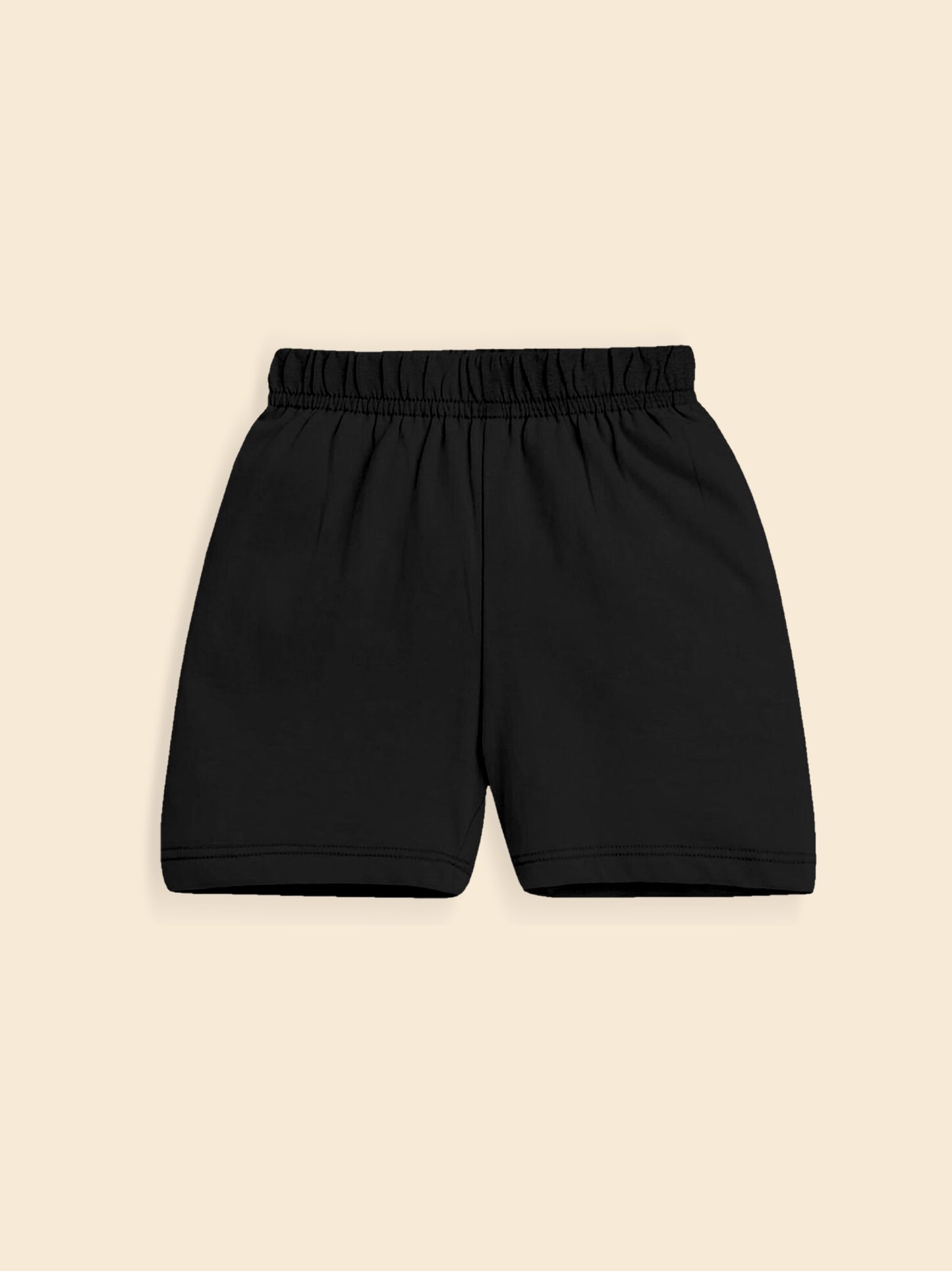 Black cotton shorts with elastic waistband on beige background