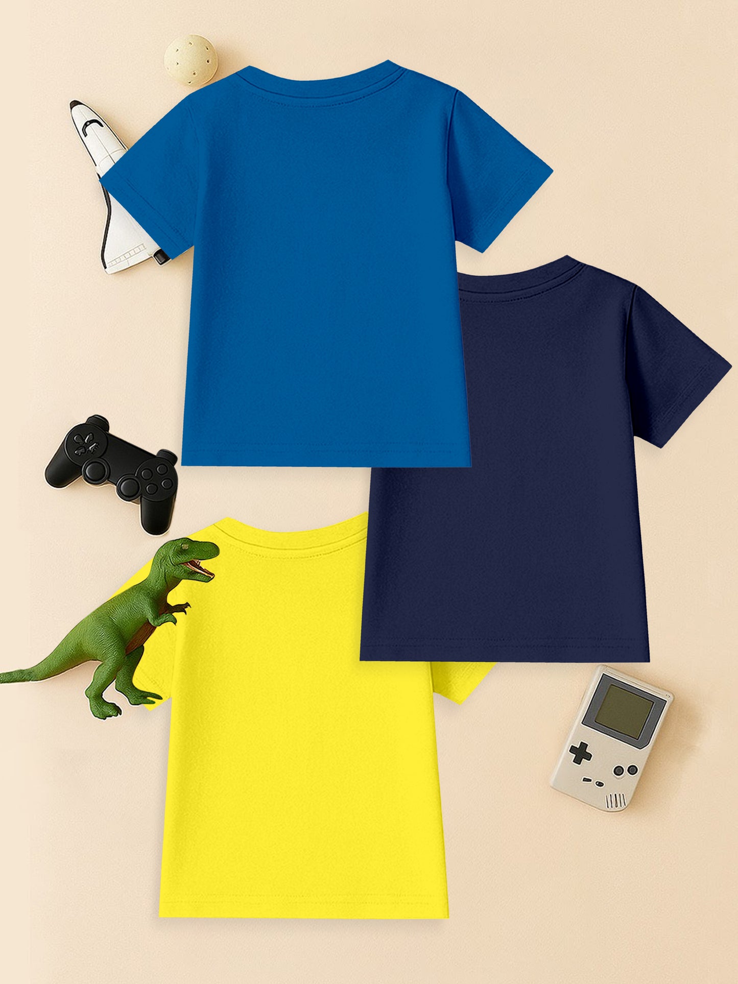 Set of three kids' t-shirts in blue, navy, and yellow with toys and gaming accessories