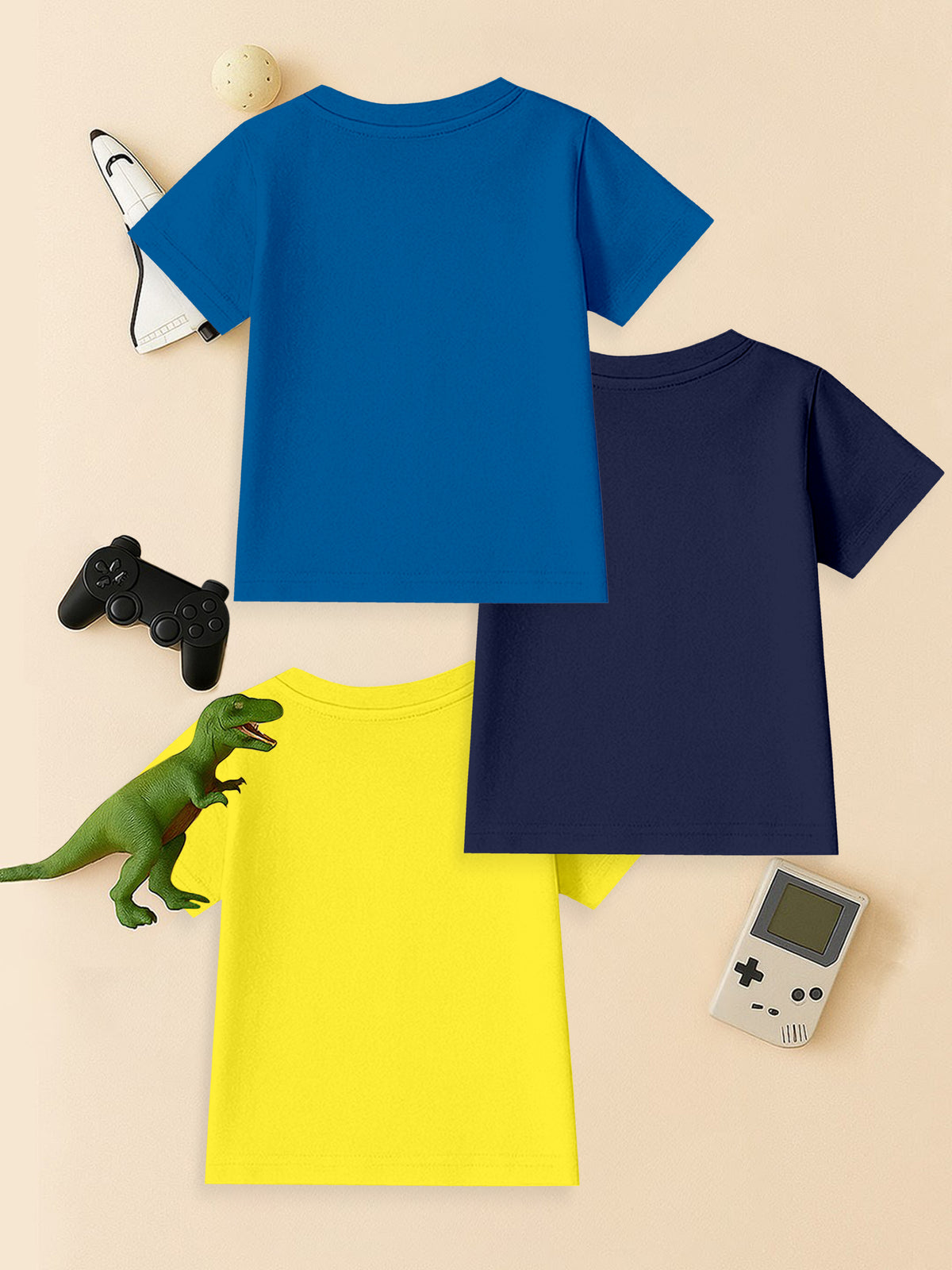 Set of three kids' t-shirts in blue, navy, and yellow with toys and gaming accessories