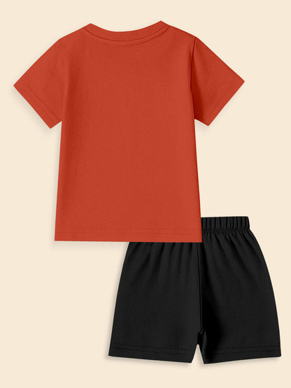 Kids set with short sleeve red t-shirt and black shorts, flat lay on beige background