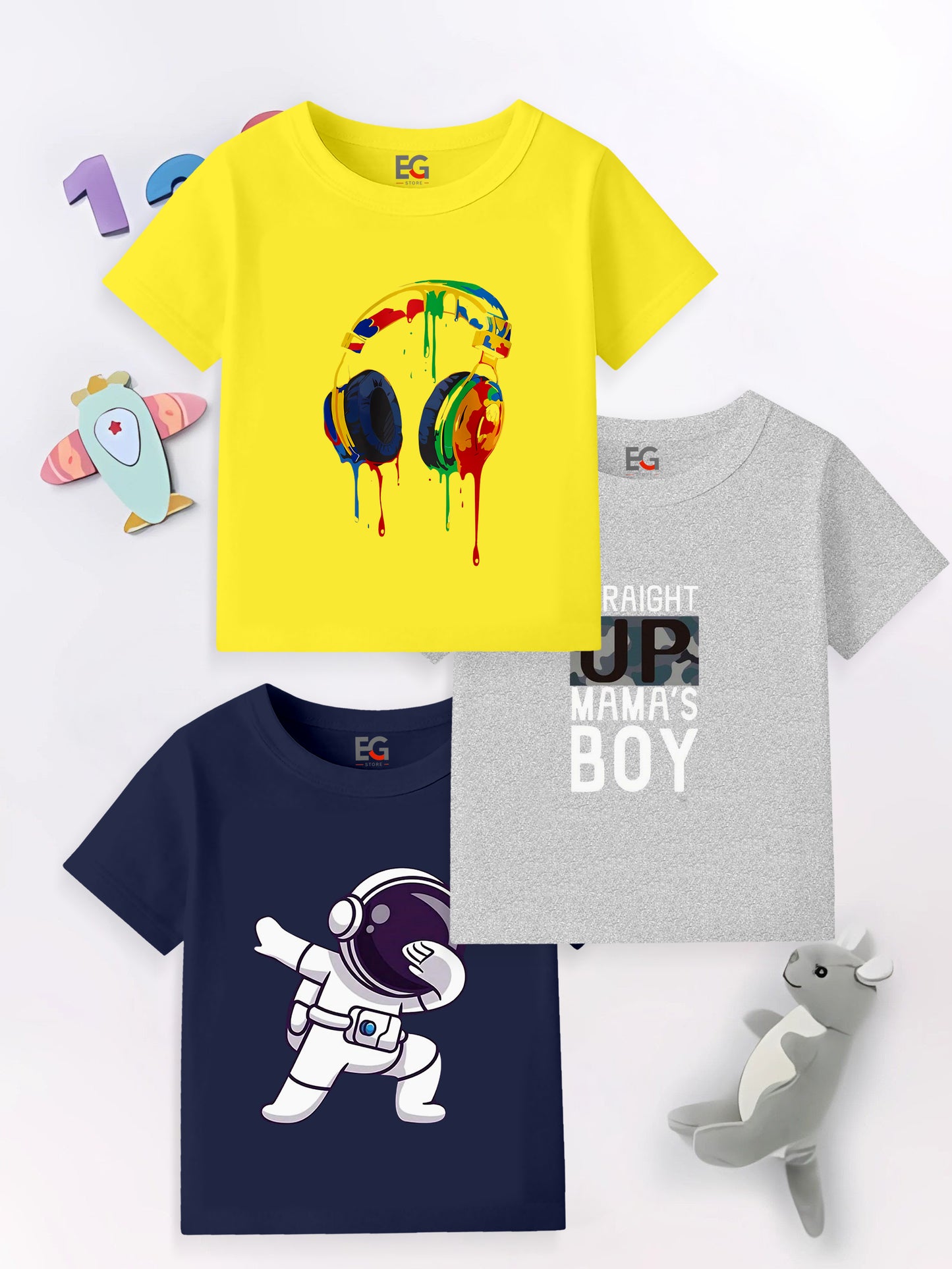 Colorful kids t-shirts with headphone, astronaut, and text designs, surrounded by toys