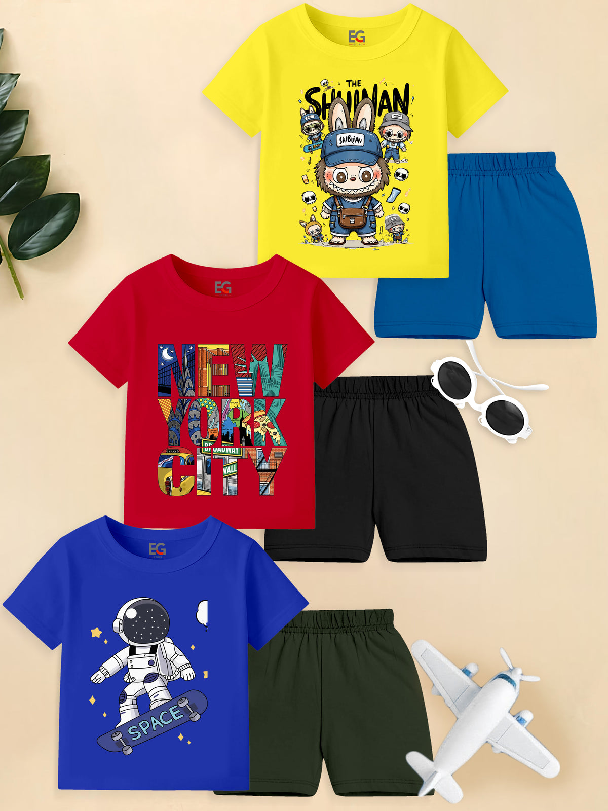 Colorful kids summer clothing sets with graphic t-shirts and shorts, playful designs, flat lay
