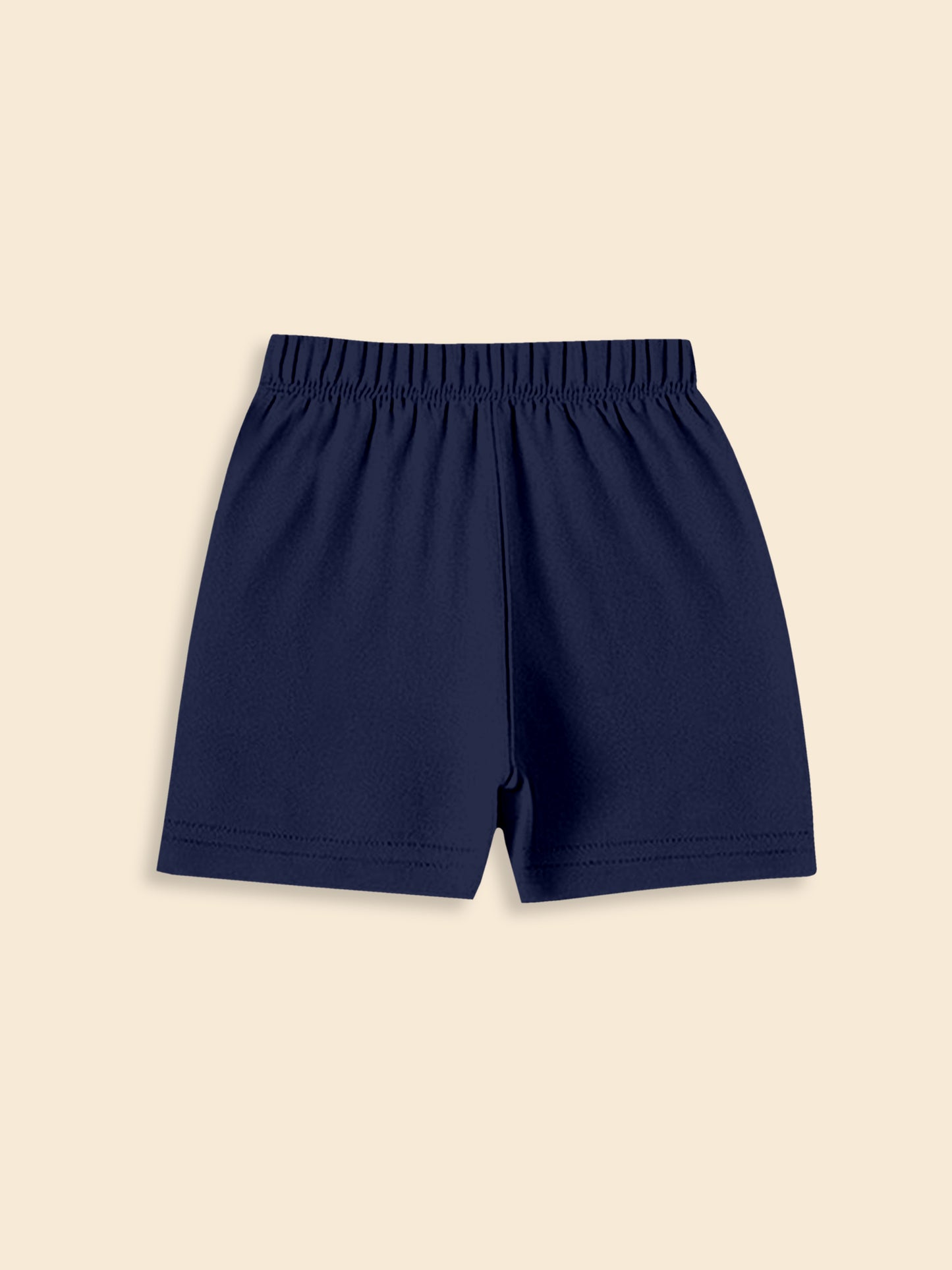 Navy blue elastic waist shorts on beige background, casual kids clothing