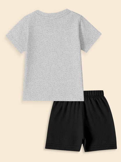 Back view of gray short-sleeve t-shirt and black shorts set on beige background