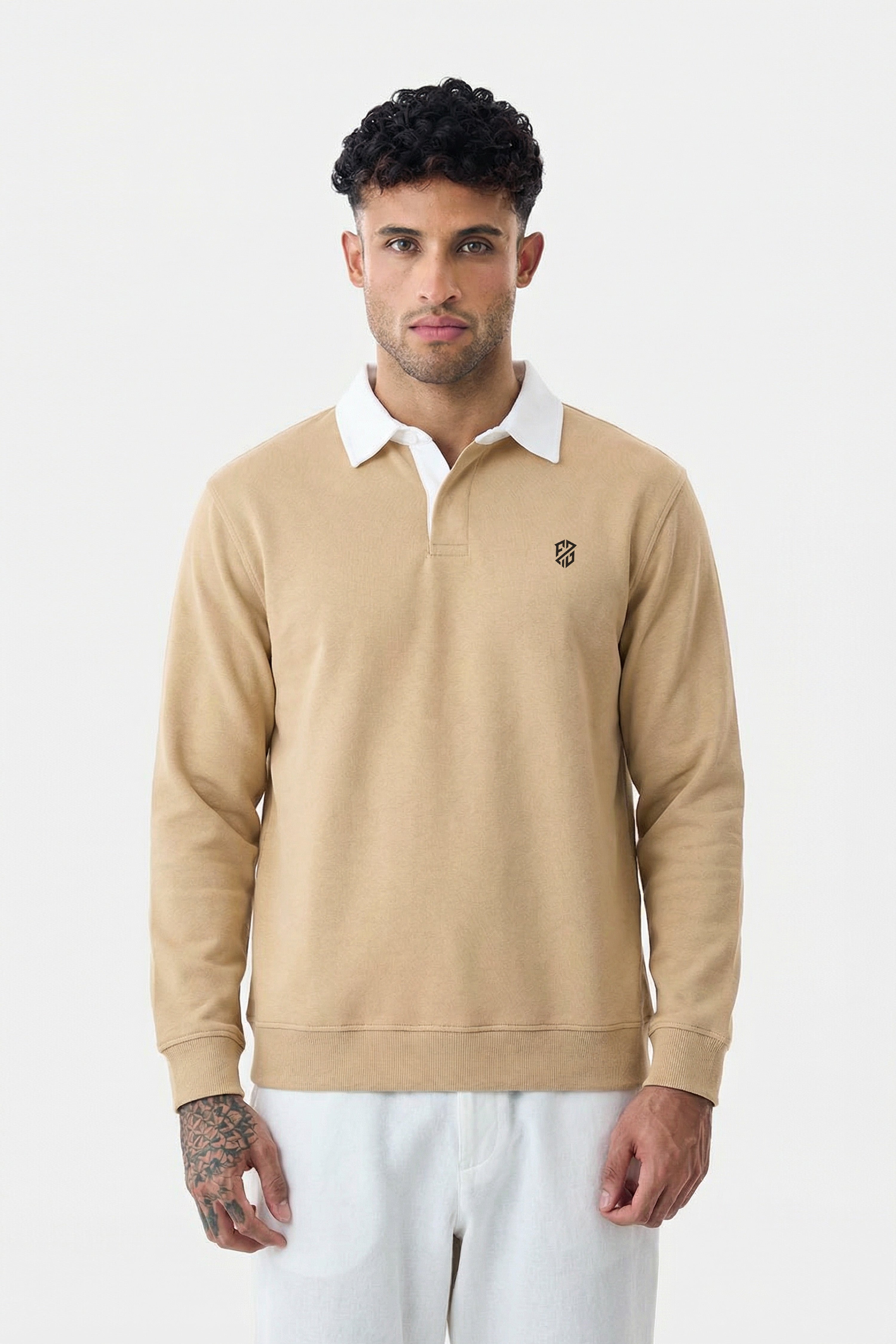Man wearing beige long sleeve rugby polo shirt with white collar, casual style