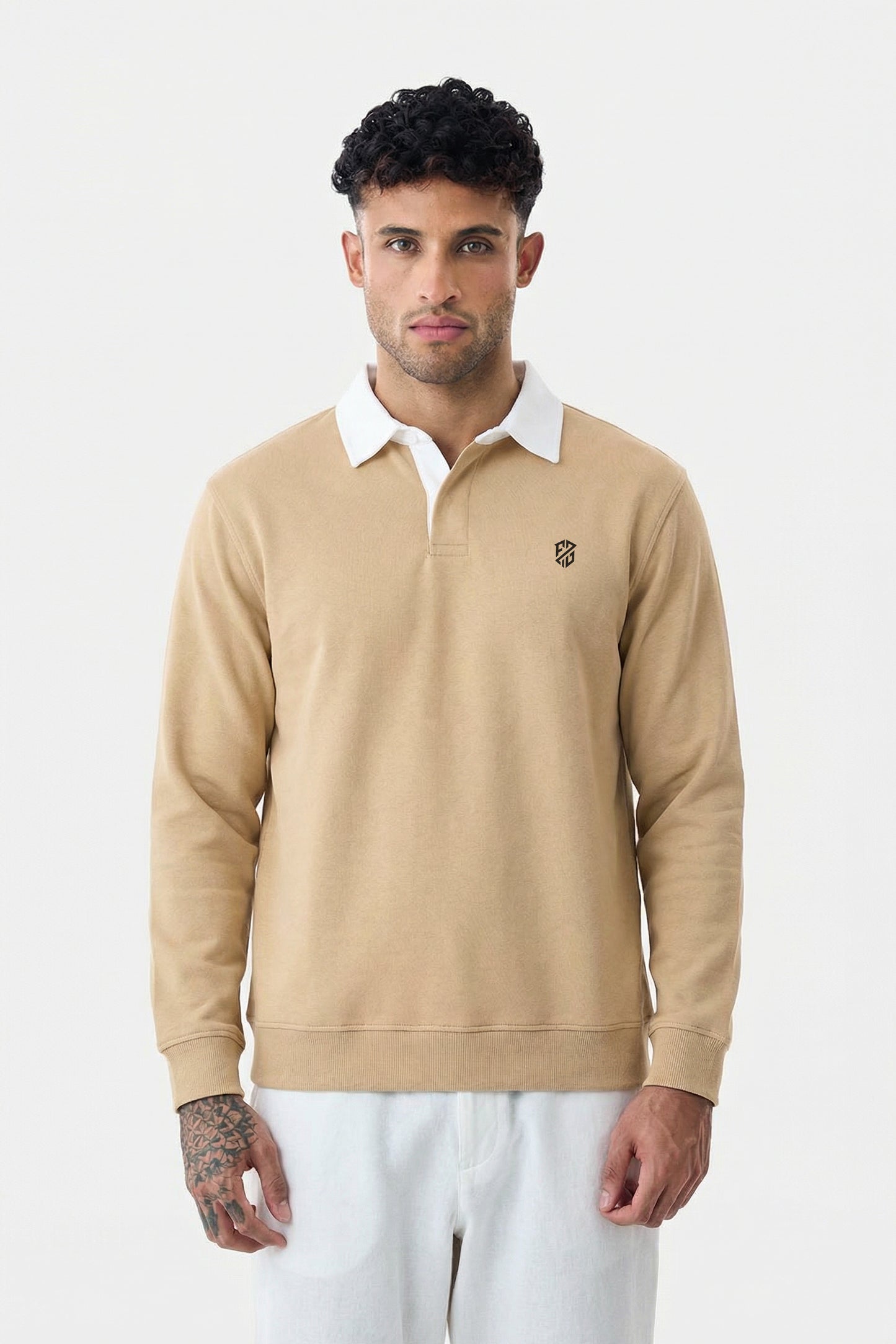 Man wearing beige long sleeve rugby polo shirt with white collar, casual style