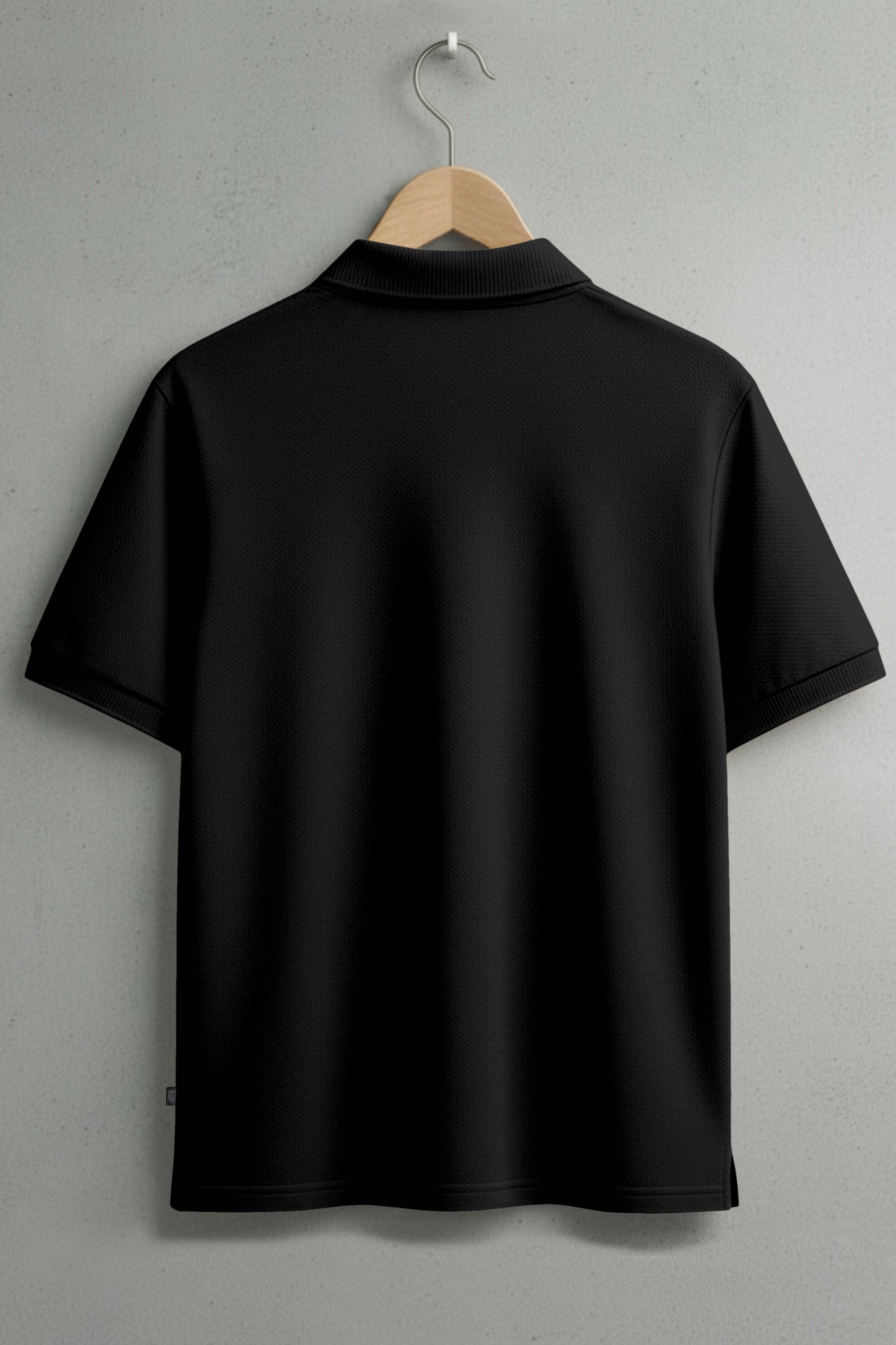 Back view of plain black short sleeve polo shirt on a hanger
