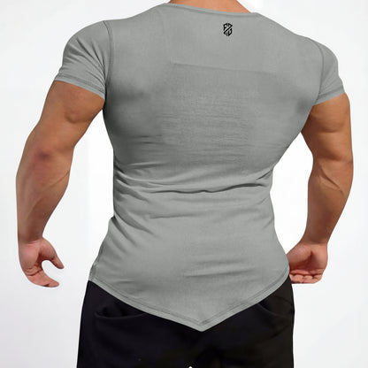 Back view of man wearing fitted grey short sleeve t-shirt with angled hem