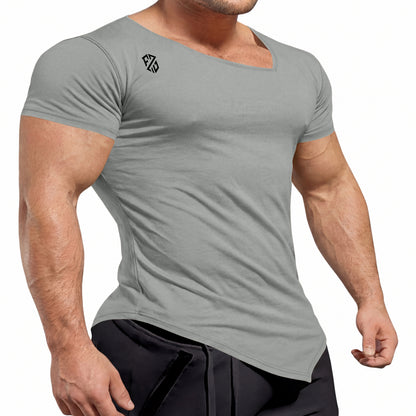Athletic man wearing fitted light gray short sleeve gym t-shirt with logo and black pants