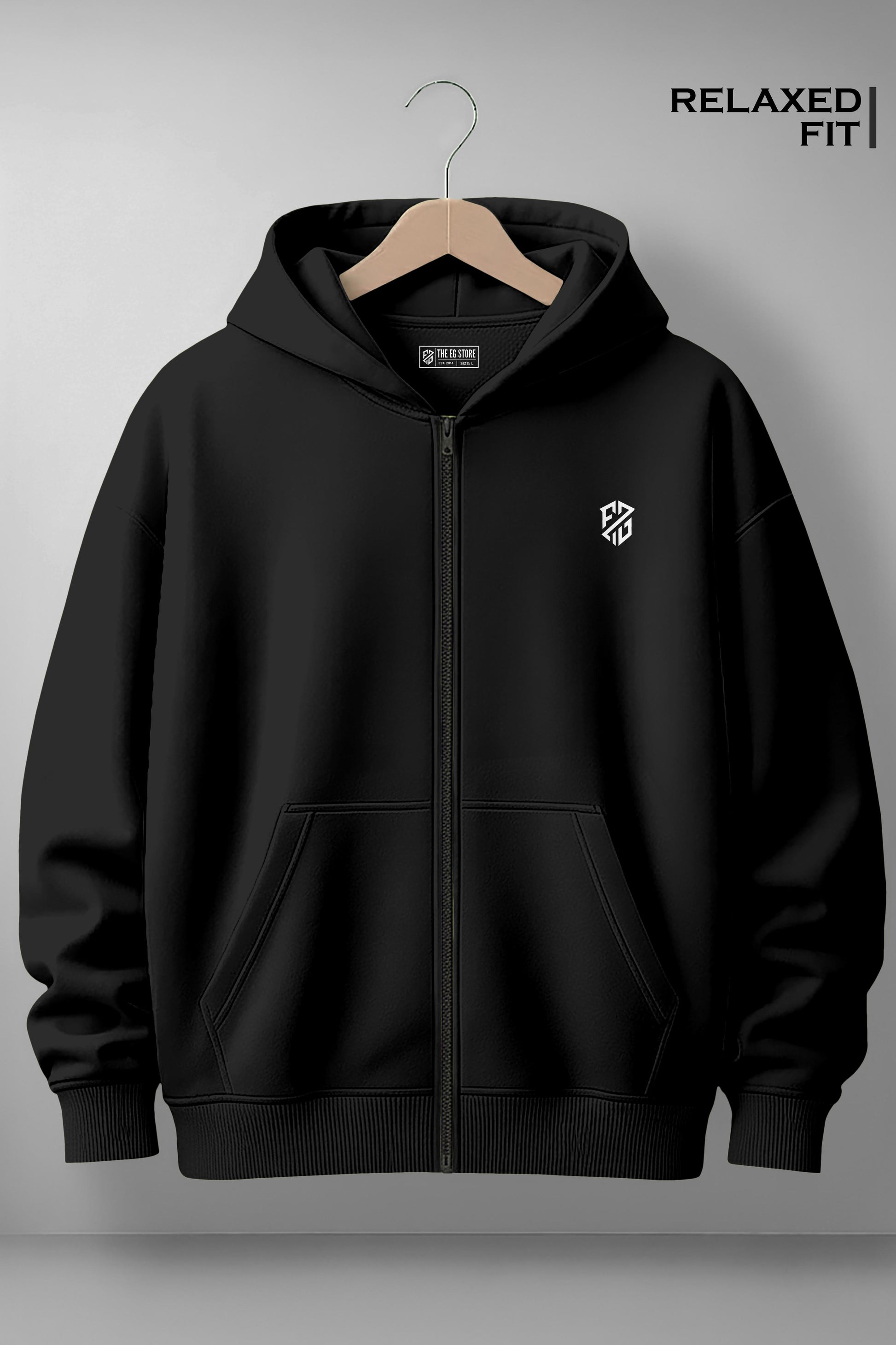 Black relaxed fit zip-up hoodie with white chest logo, front pockets, and hood on hanger