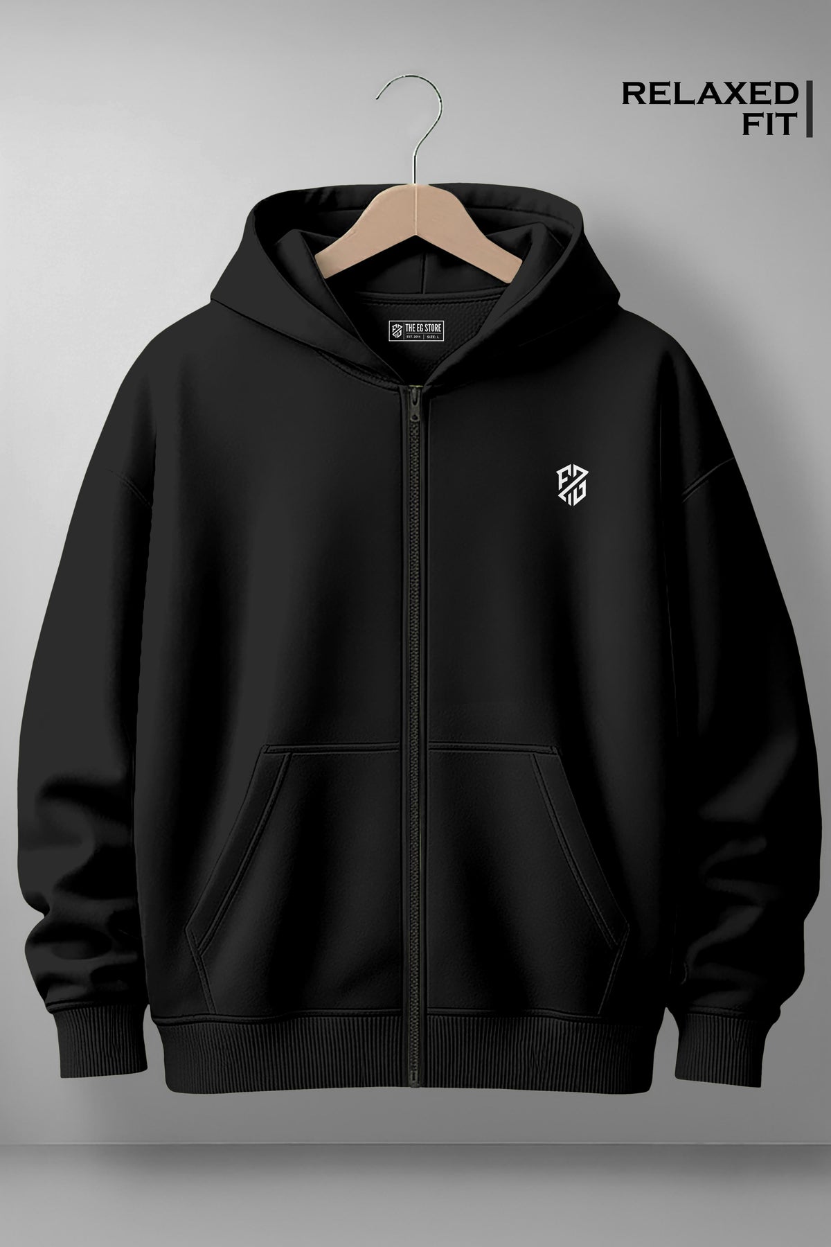 Black relaxed fit zip-up hoodie with white chest logo, front pockets, and hood on hanger