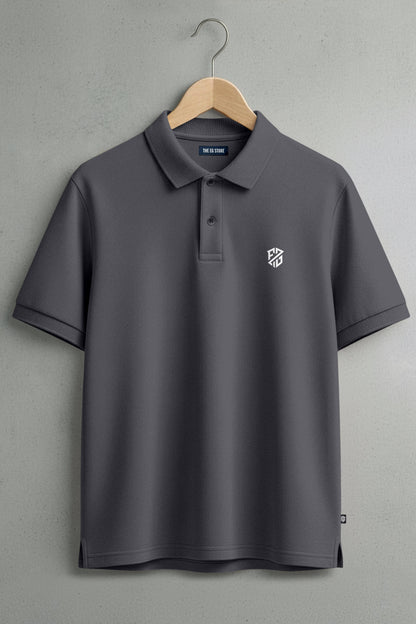 Dark grey polo shirt with short sleeves, button collar, and white chest logo on hanger