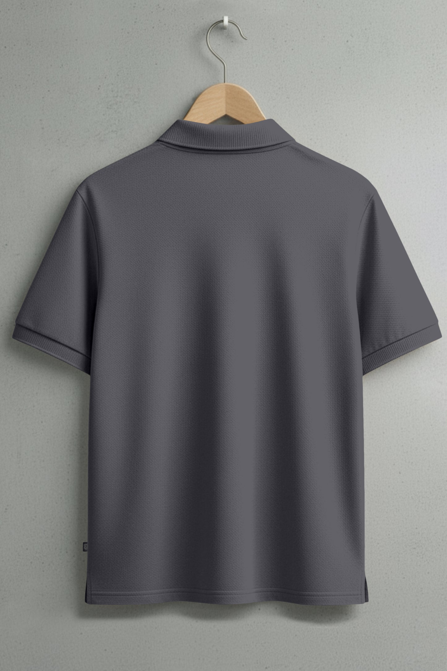 Plain dark gray short sleeve polo shirt on hanger, back view