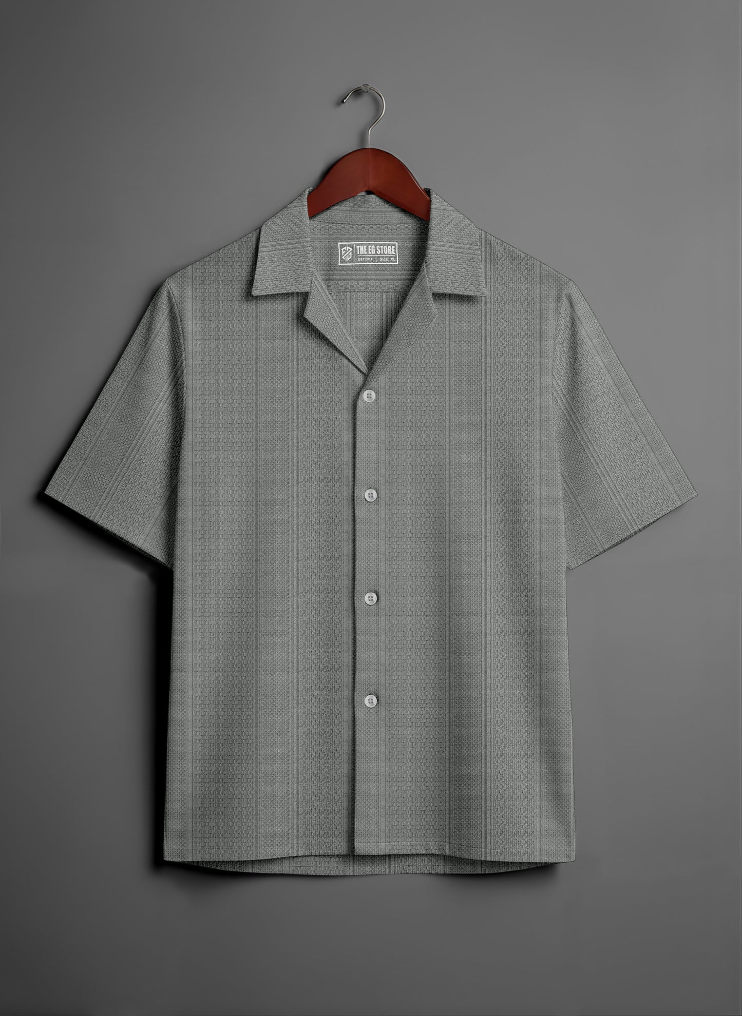 Gray short sleeve button-up shirt with subtle textured pattern on hanger