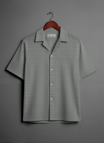 Gray short sleeve button-up shirt with subtle textured pattern on hanger