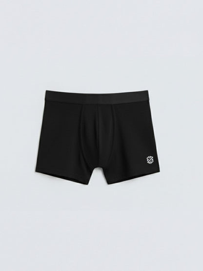 Black men's boxer briefs with logo on leg, laid flat on white background