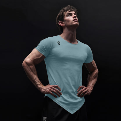 Athletic man wearing light blue fitted V-neck t-shirt with logo, posing hands on hips