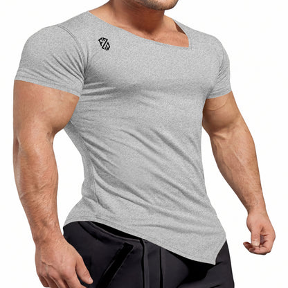 Athletic man wearing fitted light gray short sleeve t-shirt with asymmetrical neckline