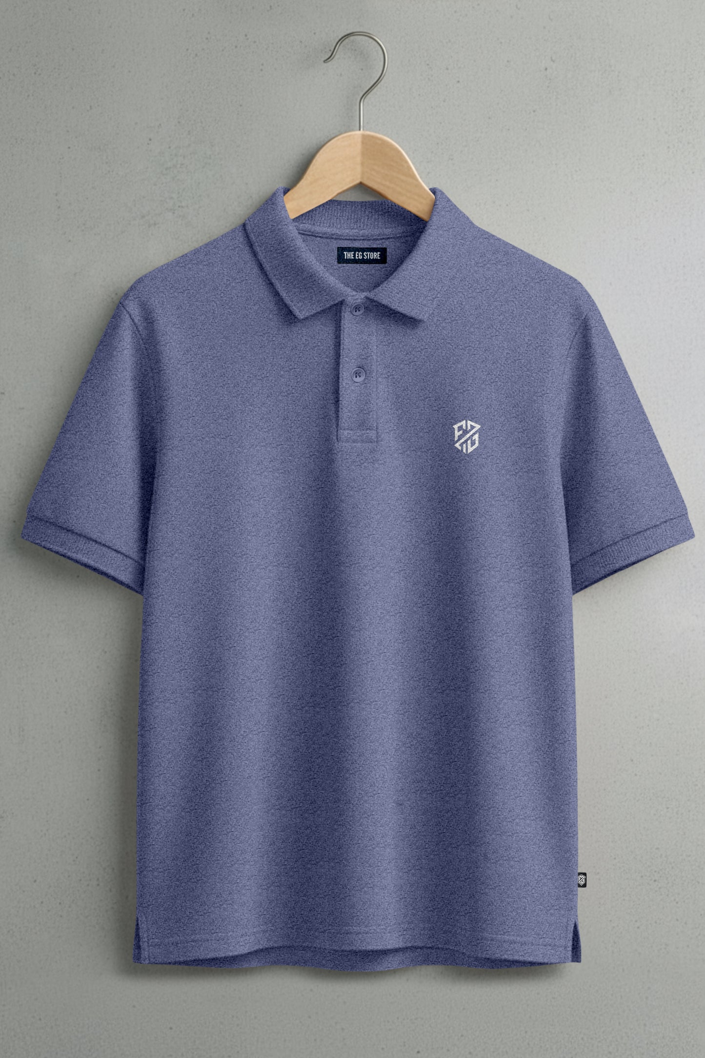 Blue short sleeve polo shirt with white embroidered logo, hanging on wooden hanger