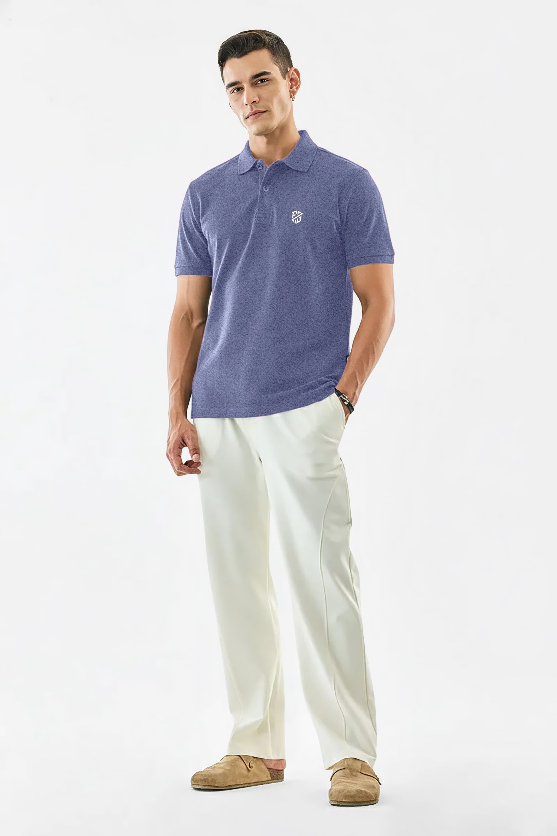 Man wearing a lavender polo shirt with logo, white trousers, and brown loafers, on white background