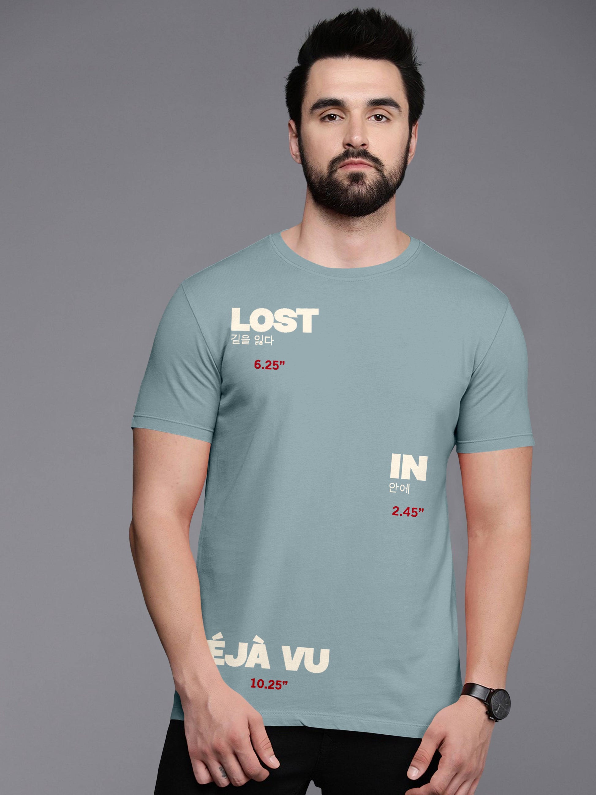 Man wearing light blue graphic t-shirt with 'LOST IN DÉJÀ VU' text and Korean characters.