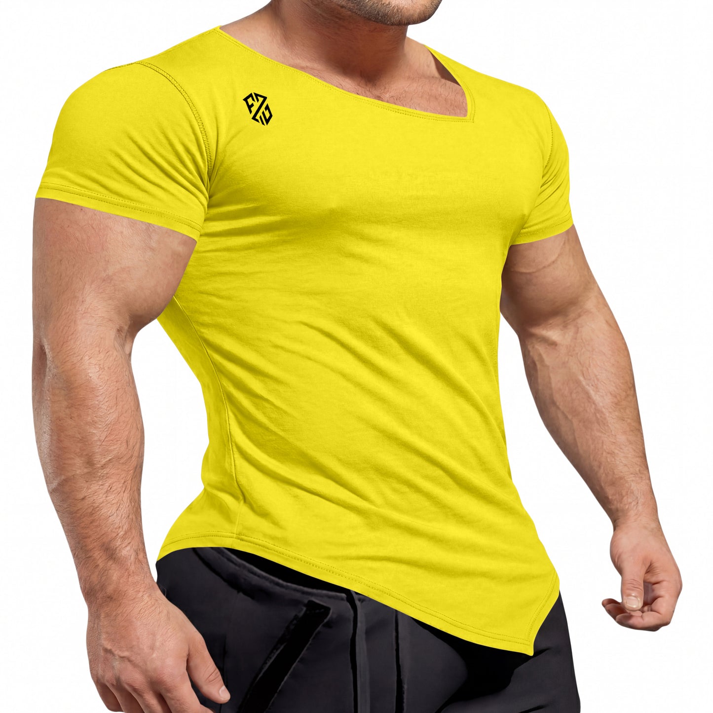 Muscular man wearing a fitted yellow crew neck t-shirt with black logo and black pants