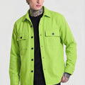 Man wearing neon green button-up overshirt with pockets, black shirt, and beige cap