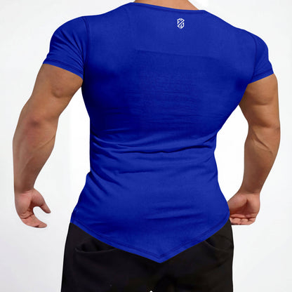 Man wearing fitted royal blue athletic t-shirt with short sleeves and geometric logo