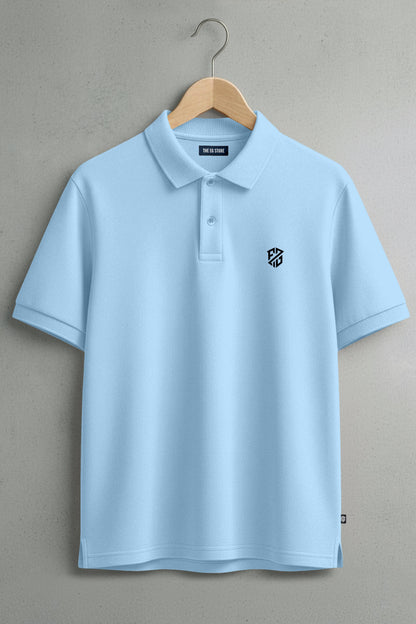 Light blue short sleeve polo shirt with embroidered logo on chest, hanging on wooden hanger