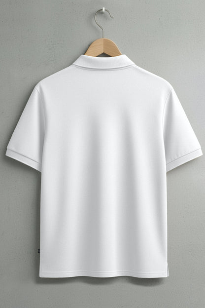 Back view of plain white short sleeve polo shirt on hanger against grey wall