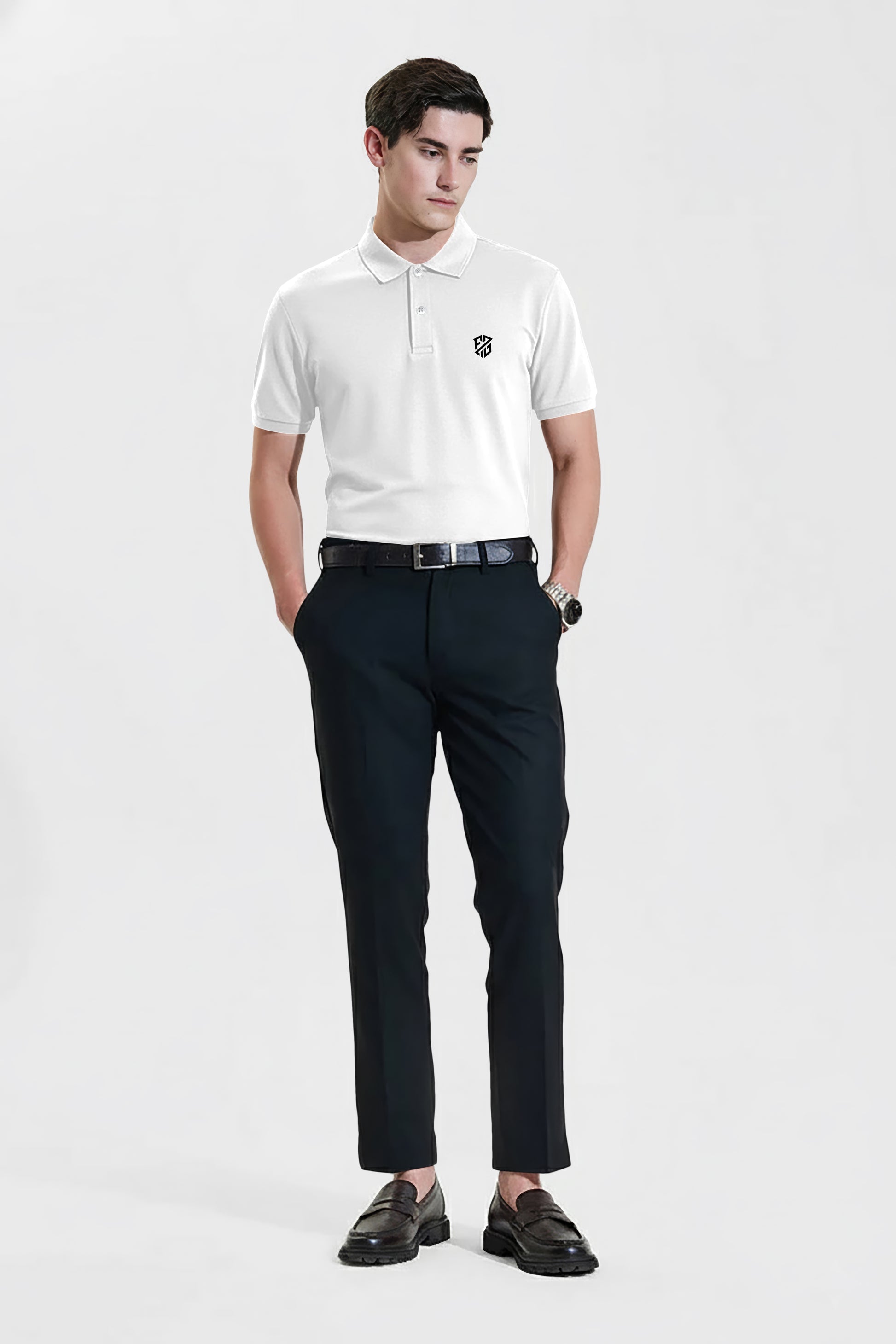 Man wearing white short-sleeve polo shirt with black pants and loafers, studio background