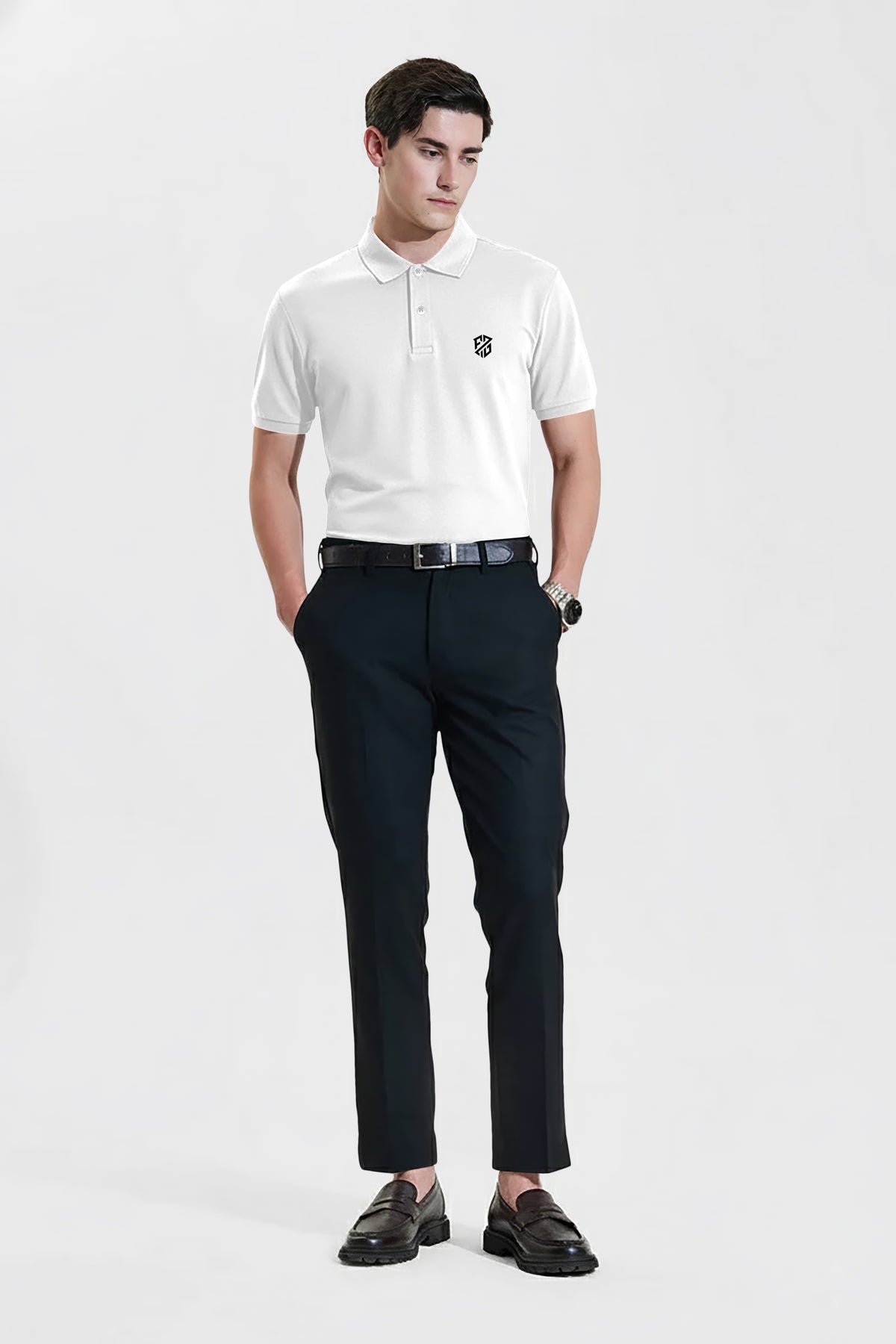 Man wearing white short-sleeve polo shirt with black pants and loafers, studio background