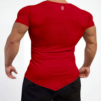 Man wearing fitted red short-sleeve shirt with pointed hem and white logo on upper back