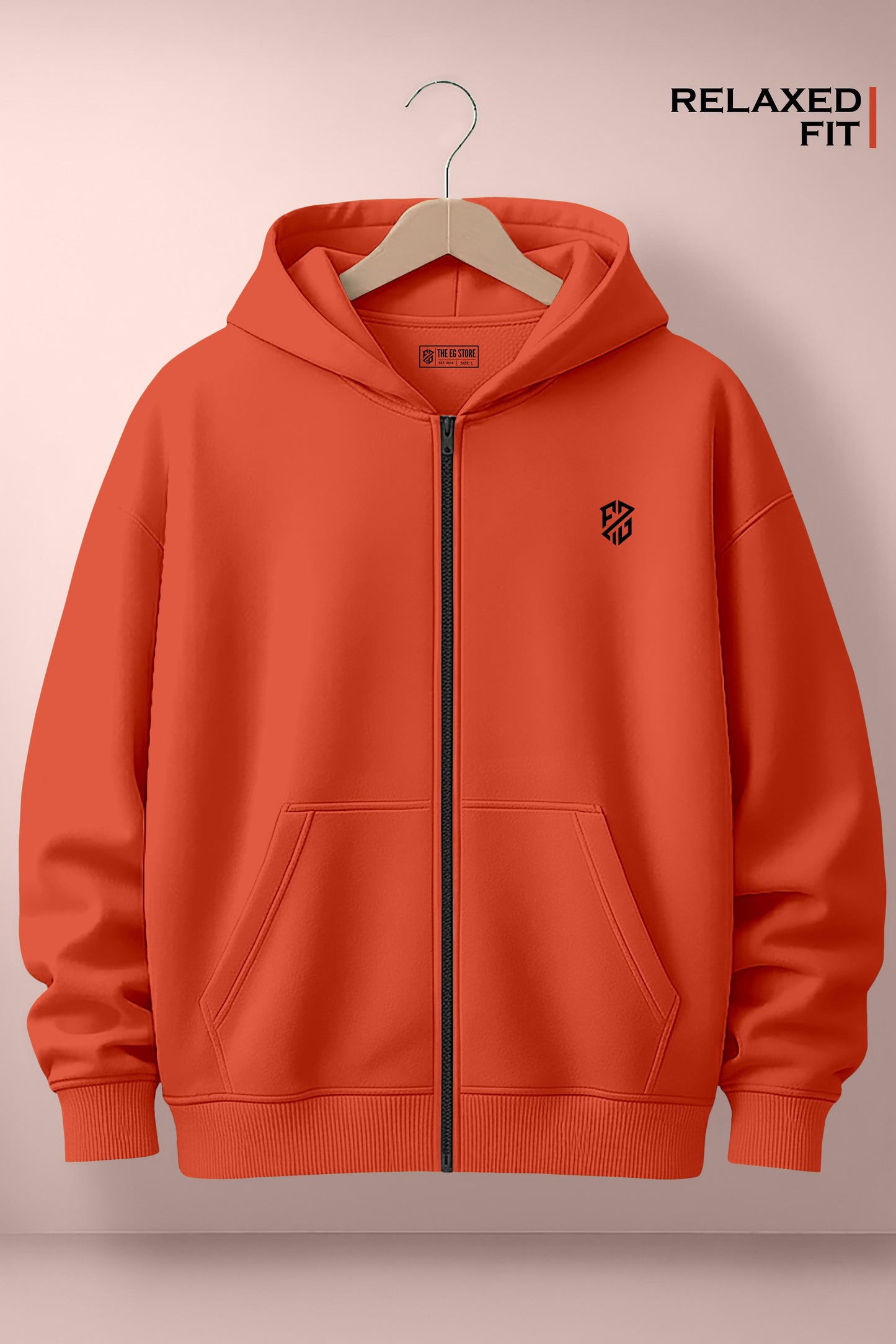 Relaxed fit orange zip-up hoodie with front pockets and black logo on chest