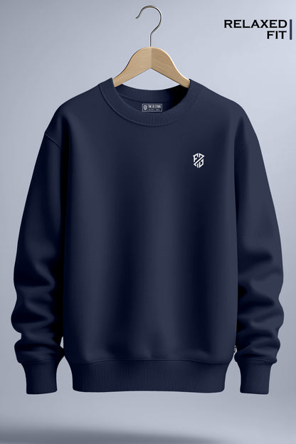 Navy blue relaxed fit crewneck sweatshirt with small white chest logo on hanger.