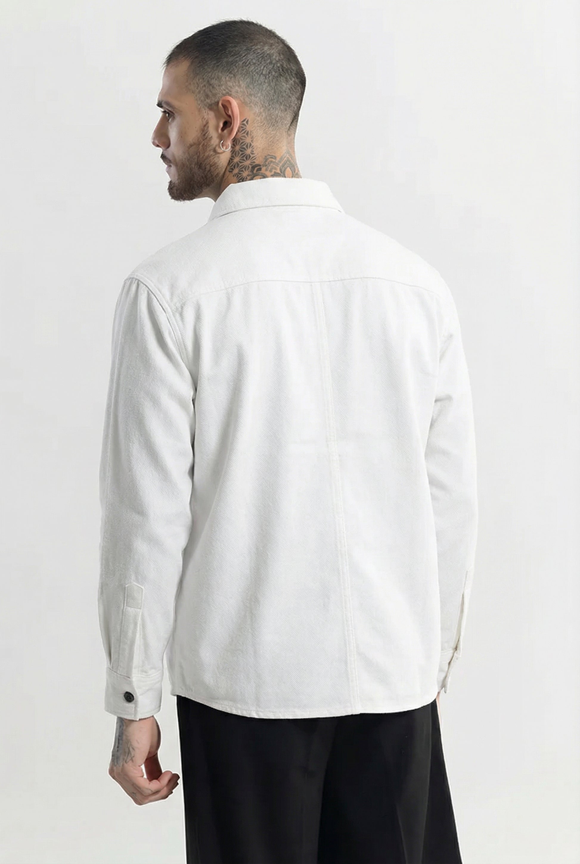 Man wearing long sleeve white shirt, back view, minimalist casual fashion