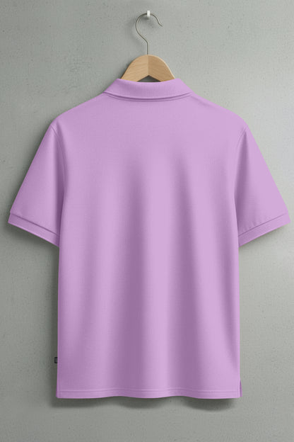 Back view of a plain light purple polo shirt on hanger against a gray wall