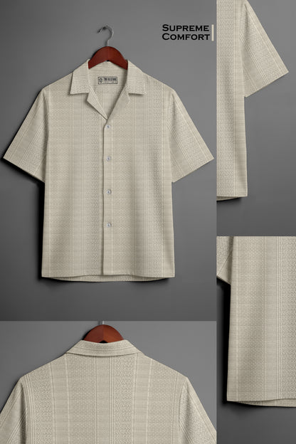 Beige textured short sleeve button-up shirt on hanger, close-up patterns and collar details