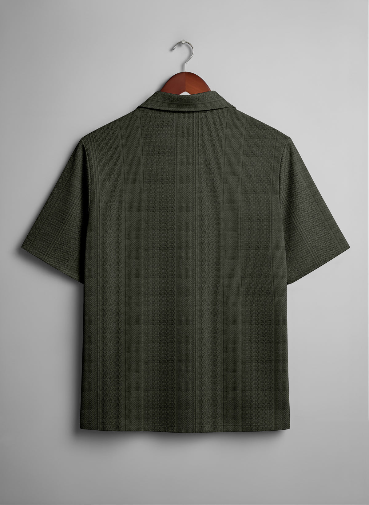 Back view of short sleeve dark green textured shirt on wooden hanger
