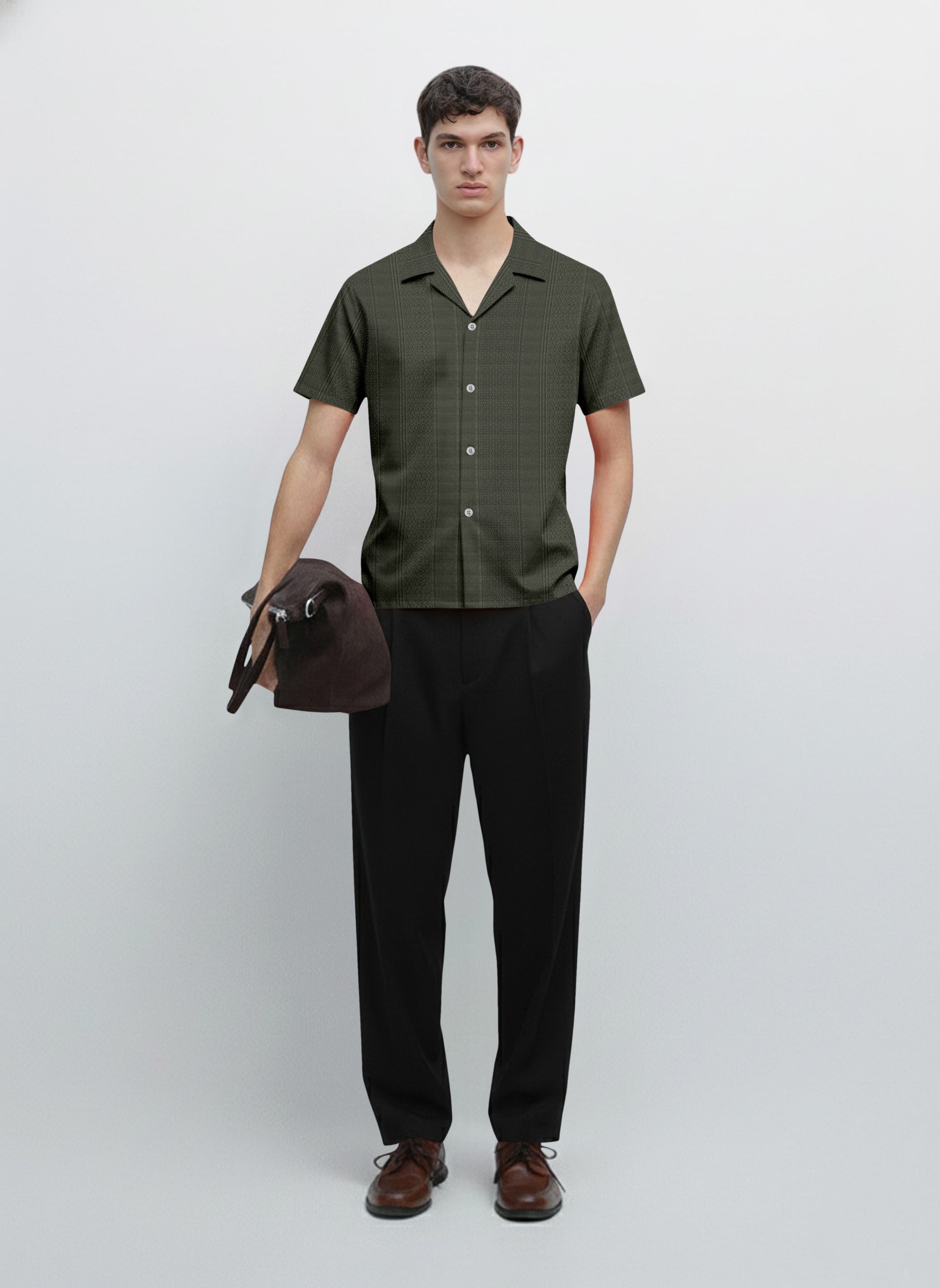 Man wearing short sleeve button-up shirt, black trousers, brown shoes, holding bag