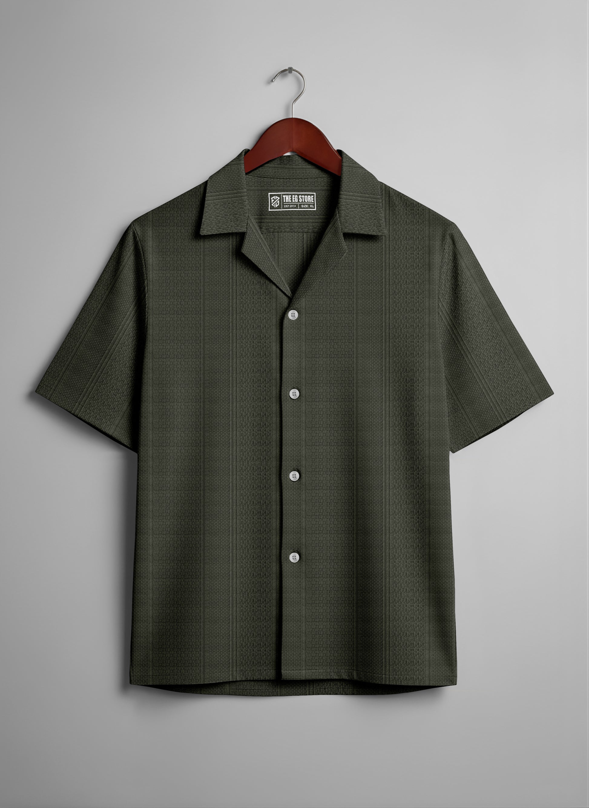 Olive green short sleeve button-up shirt with subtle texture, hanging on a wooden hanger.