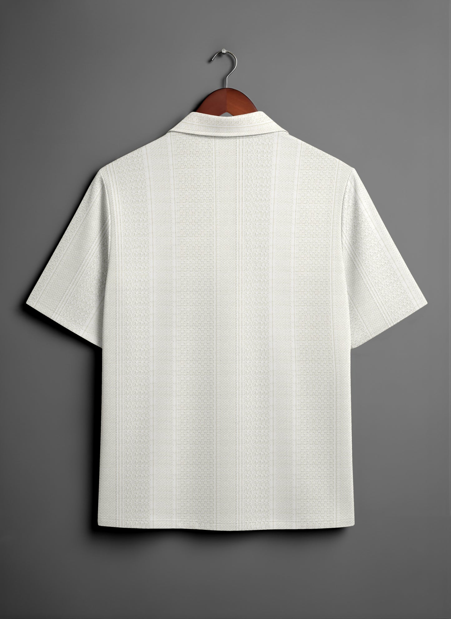 Back view of a white textured short sleeve shirt on hanger against gray background