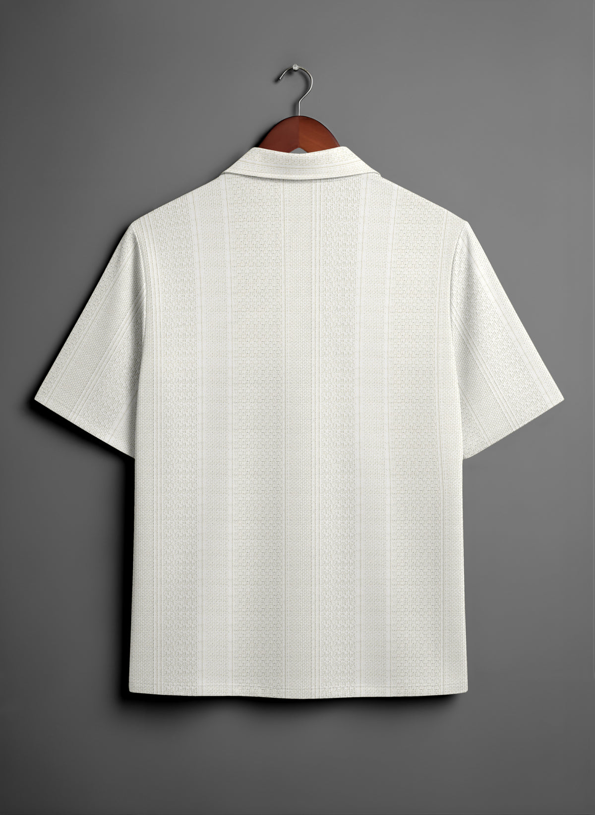Back view of a white textured short sleeve shirt on hanger against gray background