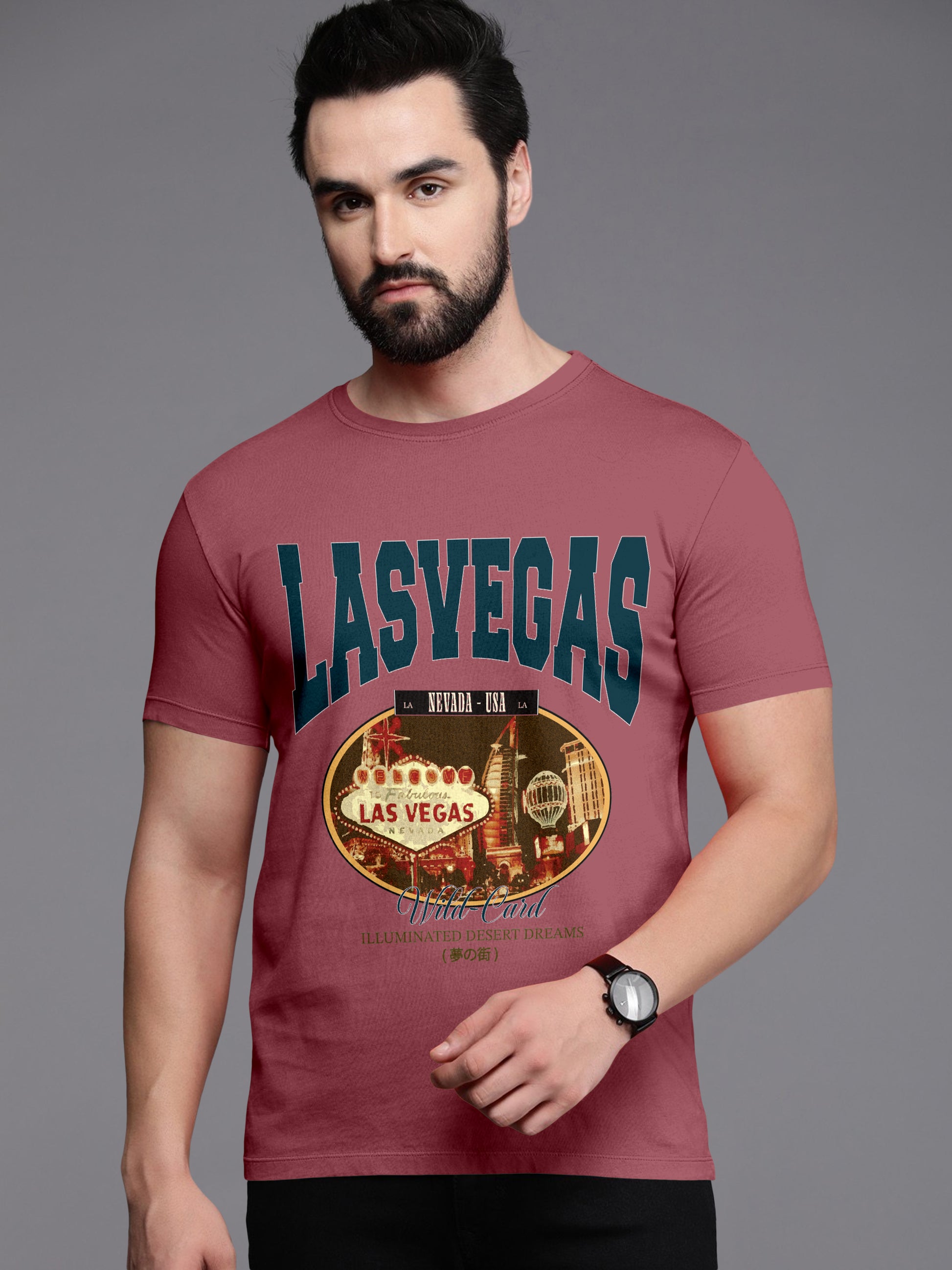 Man wearing maroon Las Vegas graphic t-shirt with city neon sign print on gray background