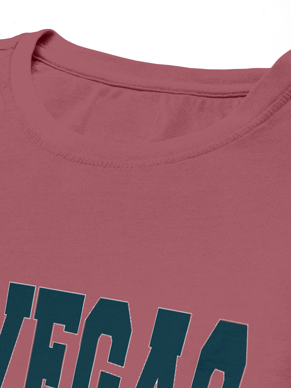 Close-up of a pink crewneck t-shirt with bold dark green lettering
